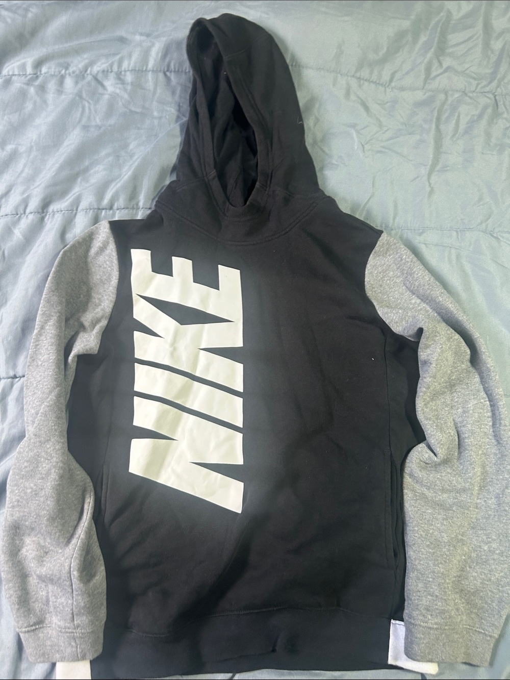 Nike Kids Black Hoodie with Gray Sleeves and White Vertical Logo